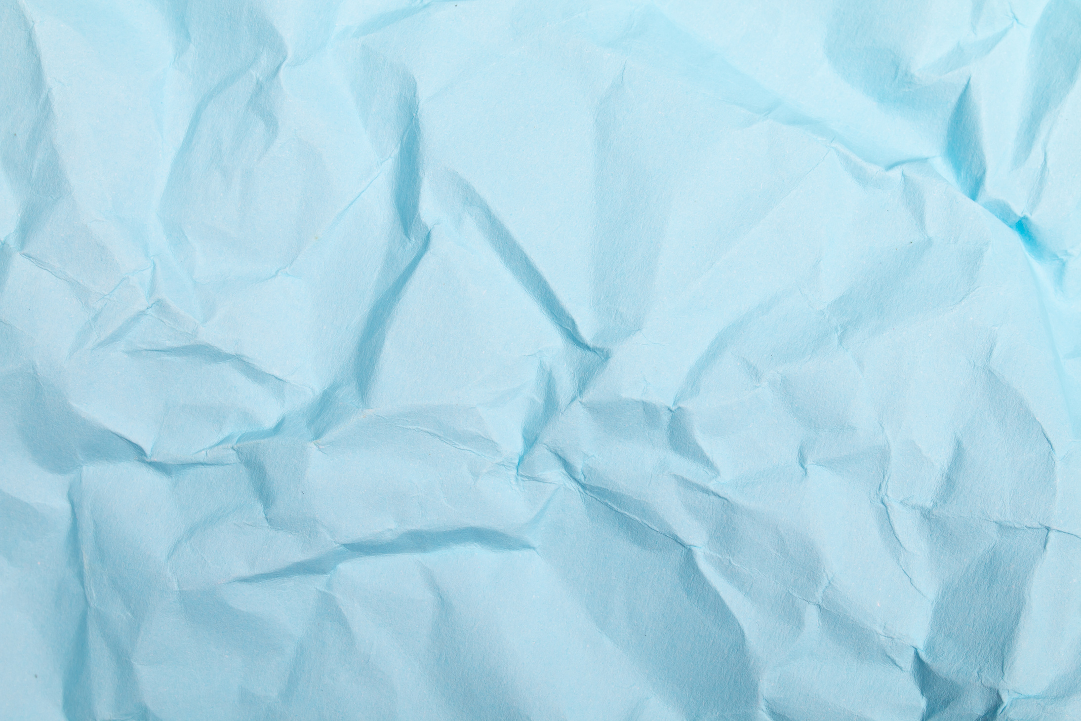  A Close-Up Shot of a Crumpled Blue Paper